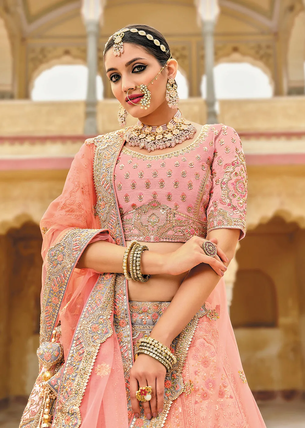 Radiant Peach Bridal Wear Heavy Embroidered Silk Lehenga Choli